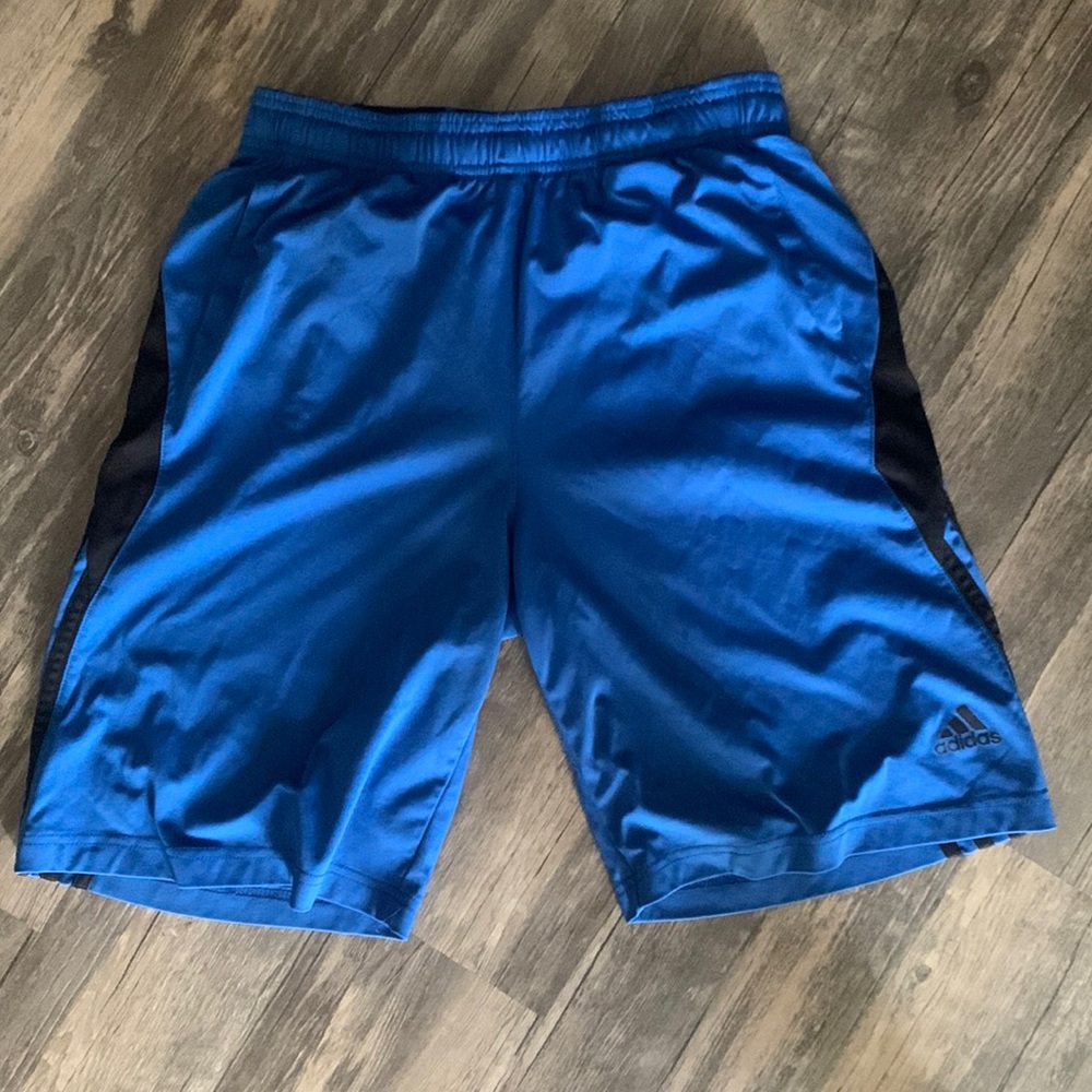 Adidas basketball shorts in good condition no stains or tears faded logo on back